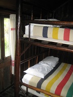Bed built inside after cabin was built.