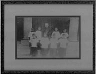 Unidentified priest and altar boys. 1890-1930?